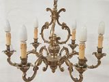 a chandelier with five lights hanging from it