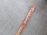 a close up of a pair of chopsticks on a table