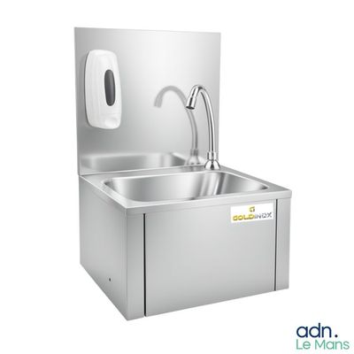 a close up of a stainless steel sink with a faucet and soap dispenser