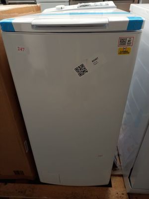 a refrigerator that is sitting on a pallet in a warehouse