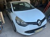 a picture of a white car parked in a garage