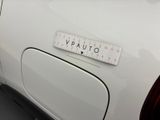 a white car with a sticker on the back of it