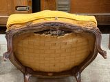 a chair with a yellow blanket on top of it