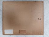 a brown box with a label on it sitting on a marble surface
