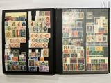 a black folder with a lot of stamps on it