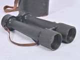 two binoculars sitting next to each other on a white surface