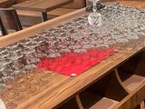 a table that has a lot of wine glasses on it