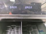 an open oven with the words open written on it