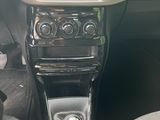 a picture of a car dashboard with a steering control
