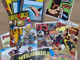 a lot of comic books on the table