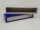 an open box with a blue lid sitting on top of a white surface