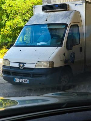 a van that is parked in front of a building