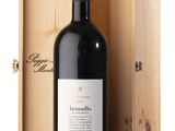 a bottle of red wine in a wooden box