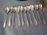 a lot of spoons that are sitting on a table