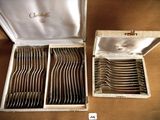 a lot of silverware in a box on a table