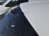 many cars parked in a parking lot next to each other