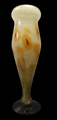 a glass vase that is sitting on a black table