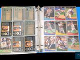 a picture of a baseball card album with baseball cards in it