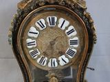 a clock that has roman numerals on the face of it