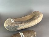 two stone slippers sitting next to each other on top of a table