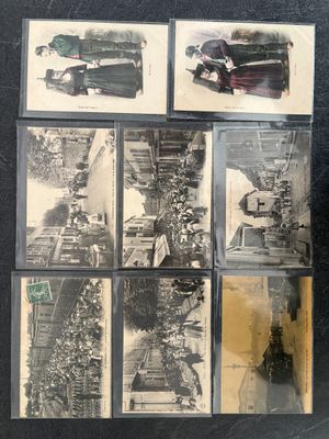 several photographs of old cars are displayed on a black surface