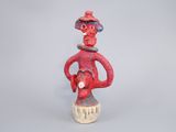 an image of a figurine of a man with a hat on his head