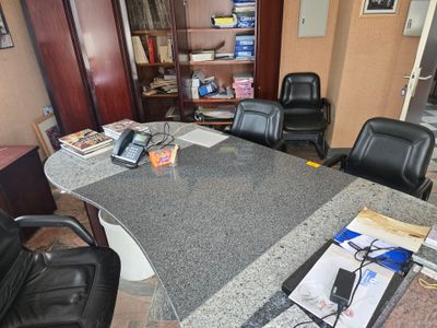 a desk that has a phone on top of it