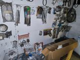 a workbench with a lot of tools hanging on the wall