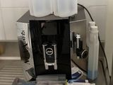 an image of a coffee machine on a conveyor belt