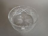 a clear glass bowl with a starburst design on it