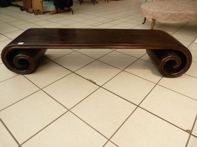 a wooden bench sitting on a tiled floor in a living room