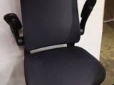 an image of a black office chair in a room