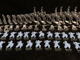 a lot of small figurines that are sitting on a table
