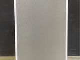 an image of a silver refrigerator sitting on top of a counter