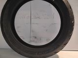 a close up of a tire tire on a white surface
