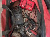 a red duffel bag with tools inside of it
