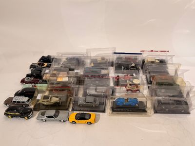 a lot of toy cars that are sitting on a table