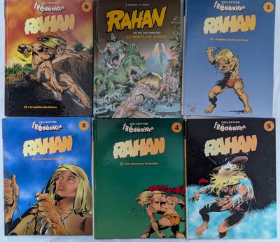 cinq albums d'une série de bandes dessinées sont posés sur une table