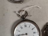 three different types of pocket watches on the table