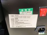 a close up of a power box with a red button