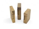 three wooden lighters sitting next to each other on a white surface