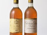 two bottles of wine that are sitting on a table