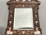 a mirror that is sitting on a table
