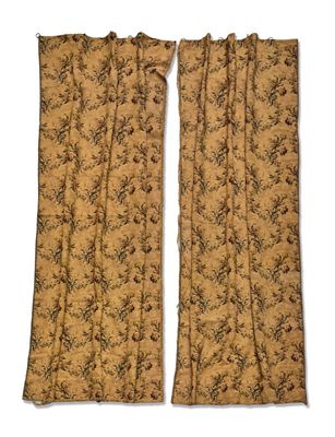a pair of curtains with a floral pattern on them