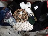 a red suitcase filled with clothes and a pair of shoes