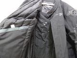 a jacket that is hanging up on a hanger
