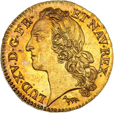 une pièce d'or représentant la tête d'une femme aux longs cheveux