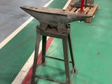 an old machine that is sitting on a green floor