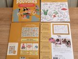 un gros plan sur un livre posé sur une table, avec un dessin d'enfant