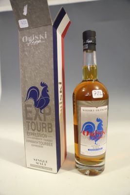 bottles of whisky and a box of wine sit on a table